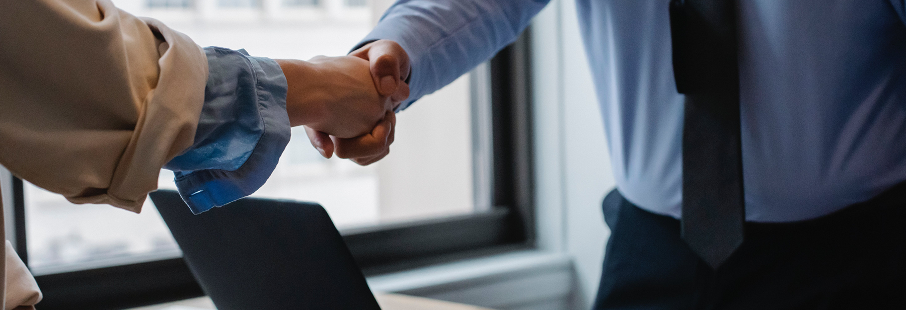 Handshake Over Desk