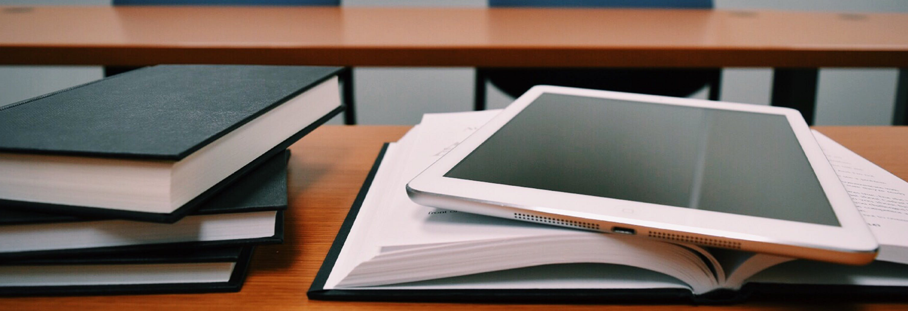 Books and iPad on desk