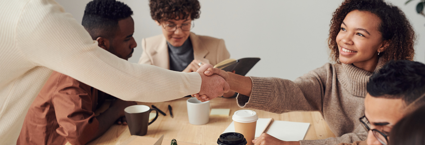 People collaborating and shaking hands